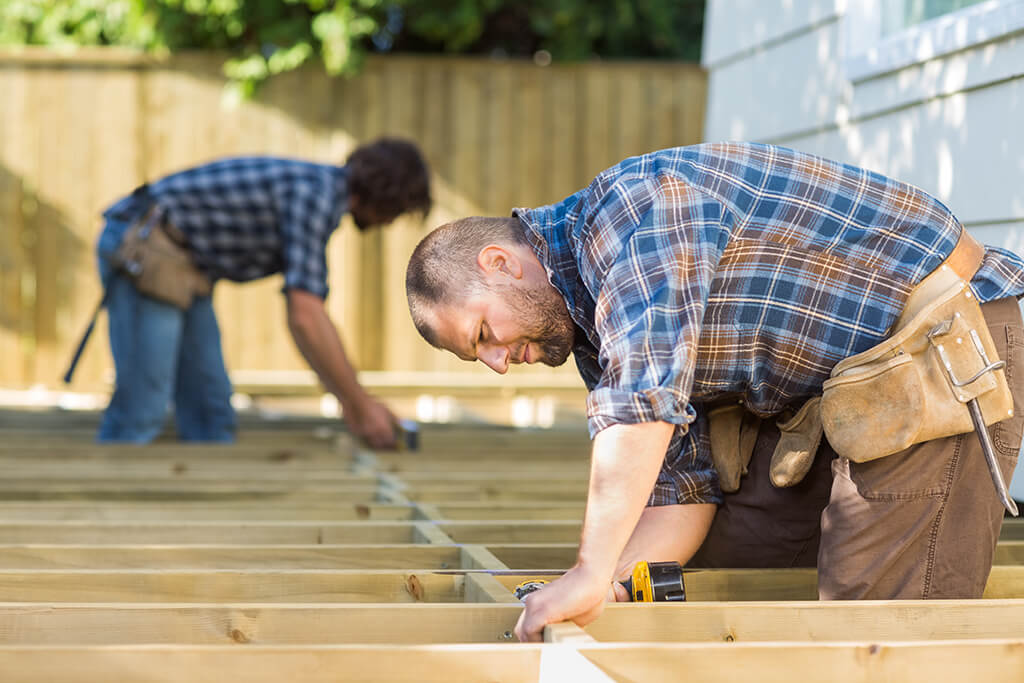 shutterstock_160848287-services Tradesmen installing a deck